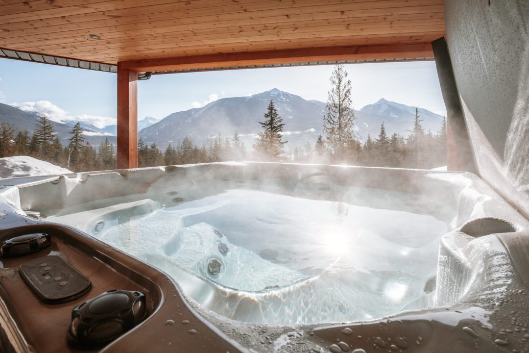 Pillows Lodge luxury property rental in Revelstoke with mountain views from hottub